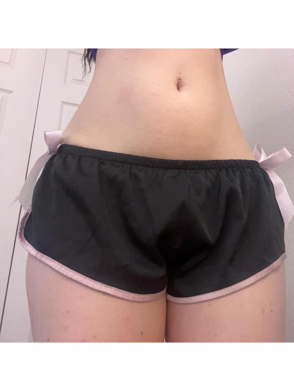 black low rise mini shorts with pink bows